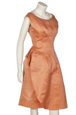 Lot 351 - A slubbed pale peach silk cocktail dress, design attributed to Balenciaga, circa 1960