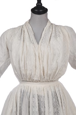 Lot 212 - A rare woven muslin round gown, circa 1795