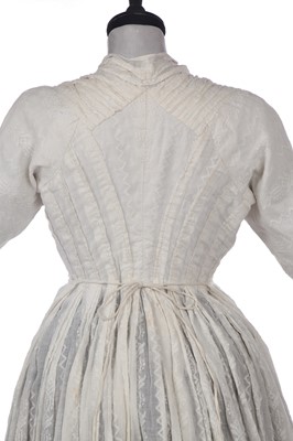Lot 212 - A rare woven muslin round gown, circa 1795