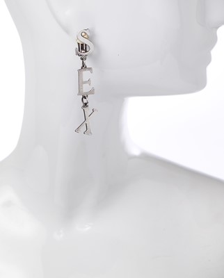 Lot 451 - A pair of Vivienne Westwood clip-on 'SEX' earrings, 'Always on Camera' collection, autumn-winter 1992-93