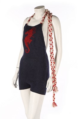 Lot 269 - A hand-knitted navy wool swimsuit with red...