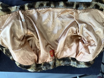 Lot 54 - A Vivienne Westwood faux leopard fur jacket and bag, 'Always on Camera' Autumn-Winter, 1992-93