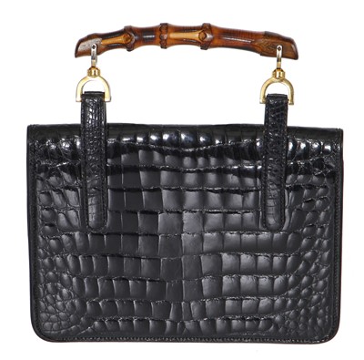 Lot 43 - A Gucci black crocodile handbag, 1960s