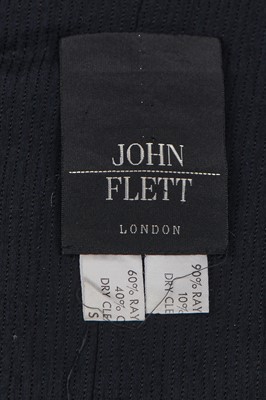 Lot 128 - A John Flett navy ribbed rayon double-breasted dress, 1980s