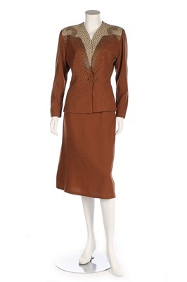 Lot 282 - A good tobacco-coloured crêpe suit, American,...