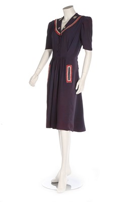 Lot 284 - A rare navy crêpe 'Victory' dress, circa 1945,...