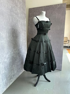 Lot 256 - A Christian Dior couture black satin cocktail dress, Spring-Summer 1956