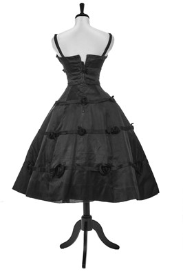 Lot 256 - A Christian Dior couture black satin cocktail dress, Spring-Summer 1956