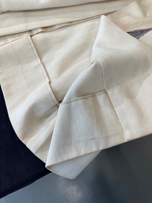 Lot 247 - A rare Hermès trompe l'oeil ivory wool coat, 1951