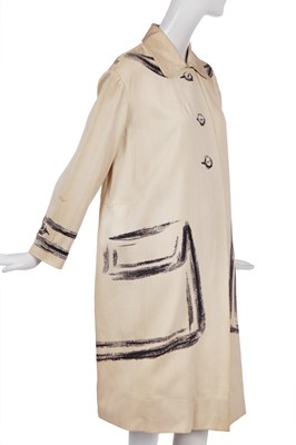 Lot 247 - A rare Hermès trompe l'oeil ivory wool coat, 1951