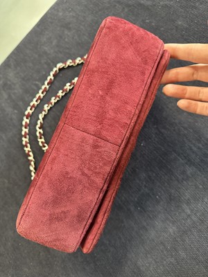 Lot 162 - A Chanel square-quilted burgundy suede flap bag, 2000-2002