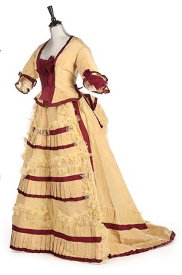 Lot 300 - A yellow and wine silk gown, 1870s, bust...