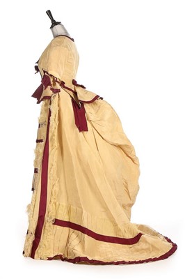 Lot 300 - A yellow and wine silk gown, 1870s, bust...