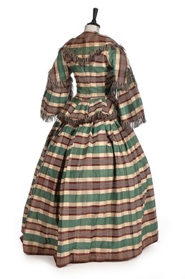 Lot 300 - A yellow and wine silk gown, 1870s, bust...