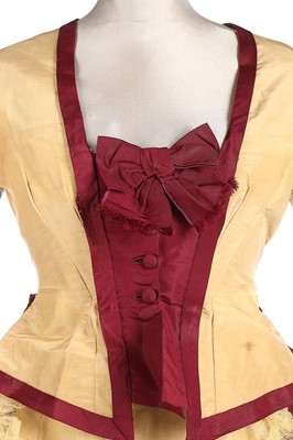 Lot 300 - A yellow and wine silk gown, 1870s, bust...