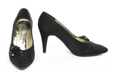 Lot 24 - Four pairs of black Chanel shoes, 1990s-modern,...