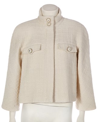 Lot 18 - A Chanel off-white tweed cropped jacket, 2019