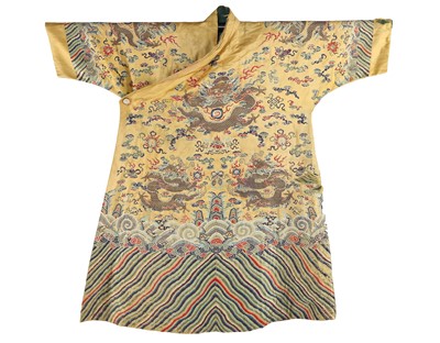 Lot 517 - An incense yellow silk Tibetan robe, chuba, formed of early 19th century Qing silk