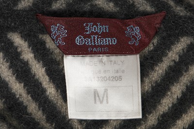 Lot 118 - A John Galliano black and grey striped wool jumper, 'Maori' collection, Autumn-Winter 1999-2000