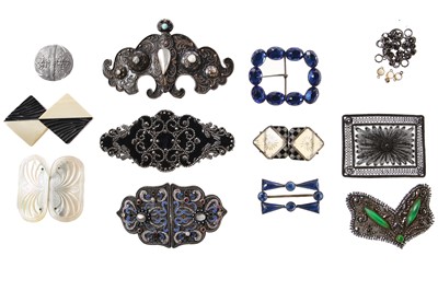 Lot 446 - A group of belts and buckles, 1900-1930s