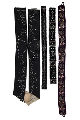 Lot 446 - A group of belts and buckles, 1900-1930s