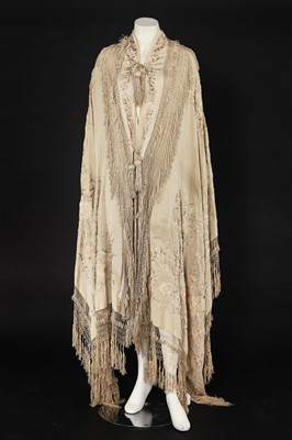 Lot 447 - A Cantonese embroidered ivory silk shaped-shawl, Chinese for the European market, circa 1910