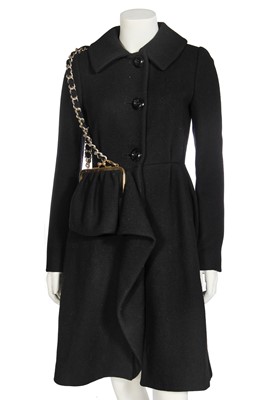 Lot 116 - A Moschino black wool coat with integral bag, early 1990s