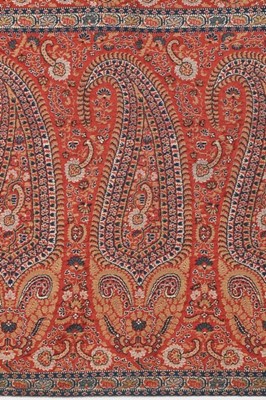 Lot 423 - A coral-pink long shawl, Norwich, circa...