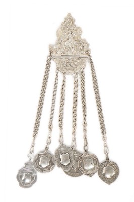 Lot 335 - A chatelaine-brooch with six silver shield...