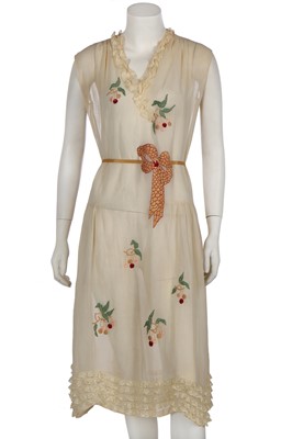 Lot 415 - A pale yellow muslin summer dress embroidered with cherries and bow, circa 1925