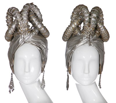 Lot 296 - Two silver lamé 'ram's horn' headdresses, 1970s