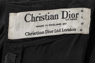 Lot 306 - A Christian Dior black satin cocktail dress, circa 1960