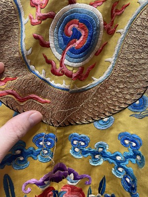 Lot 522 - An embroidered yellow satin dragon robe, Chinese for the Western market, early to mid-20th Century