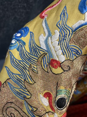 Lot 522 - An embroidered yellow satin dragon robe, Chinese for the Western market, early to mid-20th Century