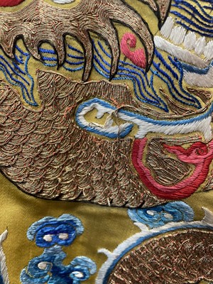 Lot 522 - An embroidered yellow satin dragon robe, Chinese for the Western market, early to mid-20th Century