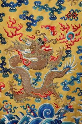 Lot 522 - An embroidered yellow satin dragon robe, Chinese for the Western market, early to mid-20th Century