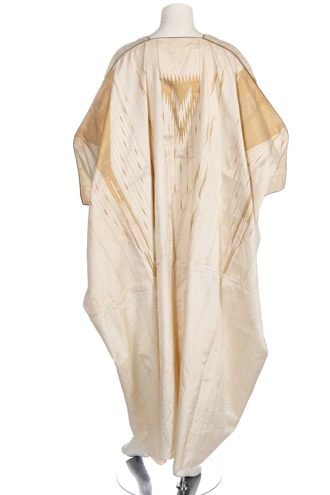 Lot 514 - An ivory and gold silk Aba robe, Syrian, circa 1920