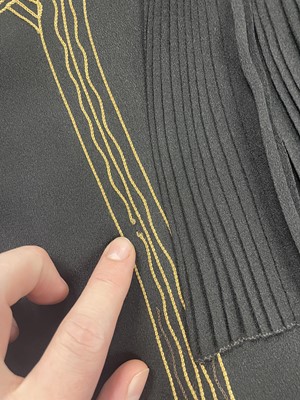 Lot 407 - A finely embroidered and pleated crêpe dress, circa 1924
