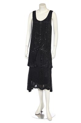 Lot 404 - A beaded black chiffon flapper dress, late 1920s