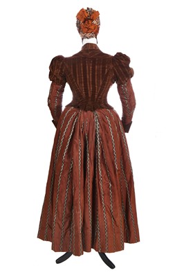 Lot 463 - A striped brown silk gown, circa 1890