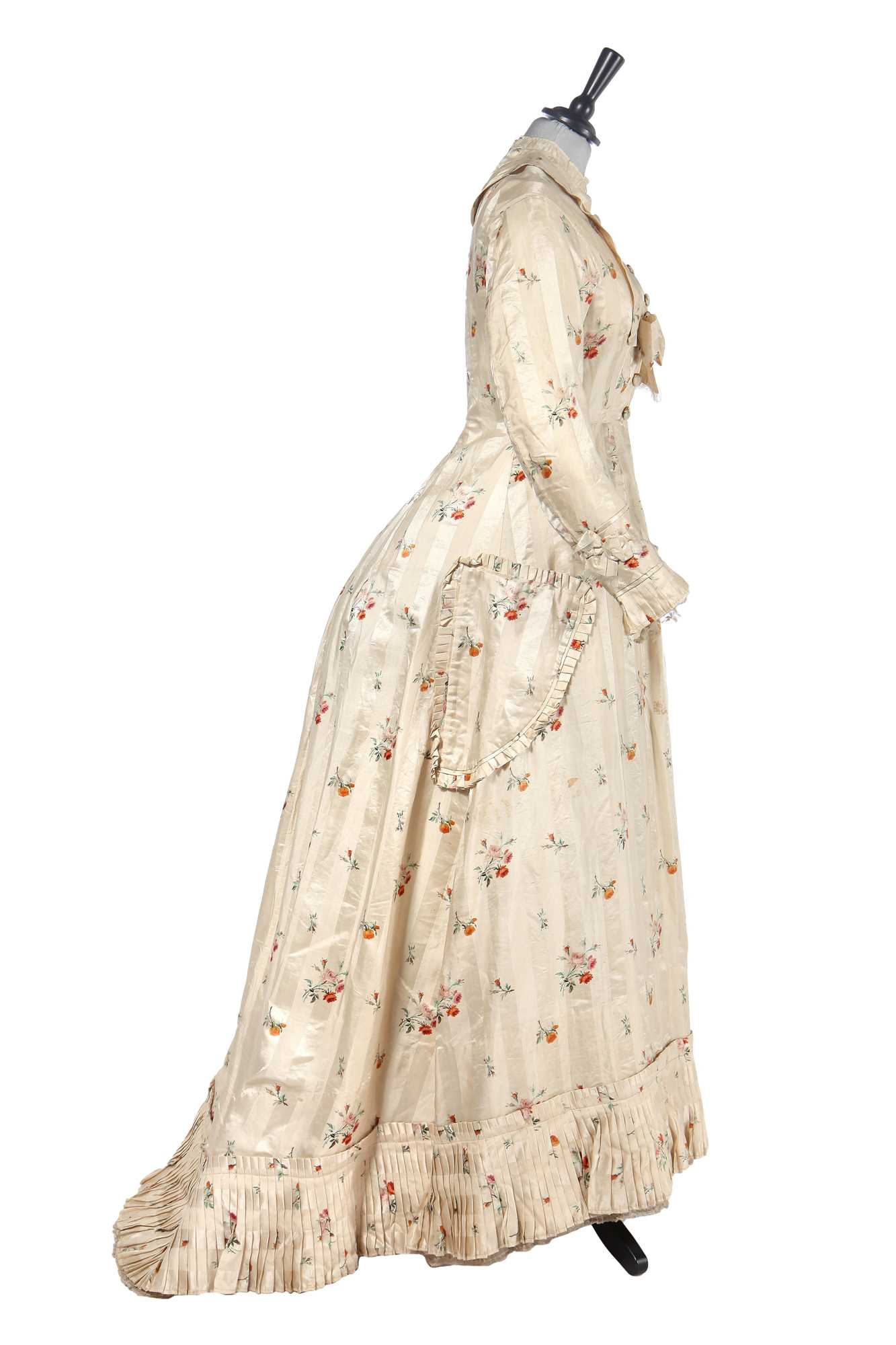 Lot 475 - A floral striped silk tea gown, late 1870s