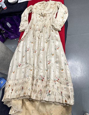 Lot 475 - A floral striped silk tea gown, late 1870s