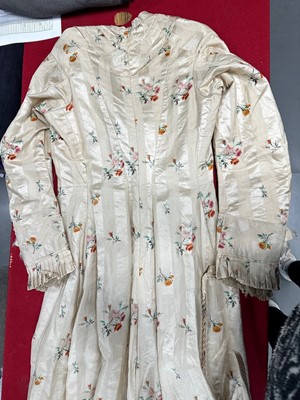 Lot 475 - A floral striped silk tea gown, late 1870s