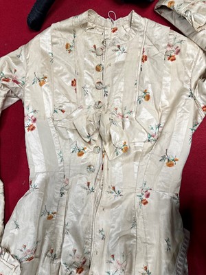 Lot 475 - A floral striped silk tea gown, late 1870s