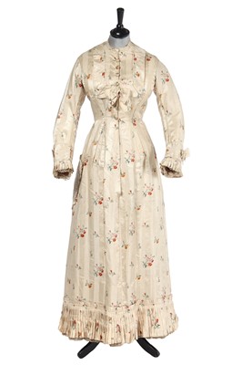 Lot 475 - A floral striped silk tea gown, late 1870s