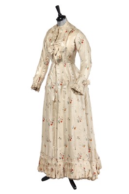 Lot 475 - A floral striped silk tea gown, late 1870s