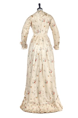 Lot 475 - A floral striped silk tea gown, late 1870s