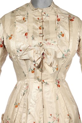 Lot 475 - A floral striped silk tea gown, late 1870s