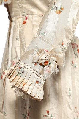 Lot 475 - A floral striped silk tea gown, late 1870s