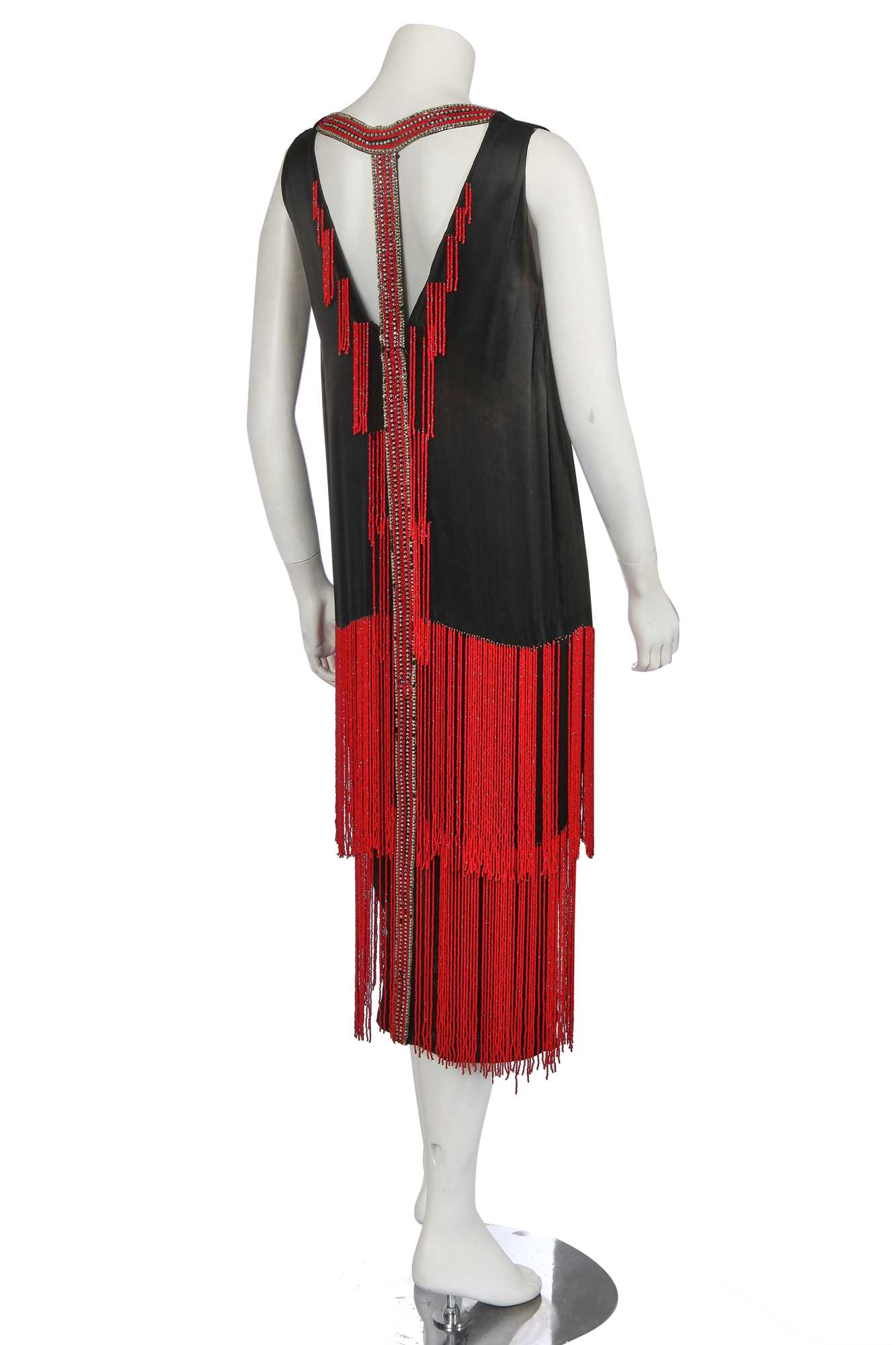 Lot 401 - A beaded black satin flapper dress, circa 1925